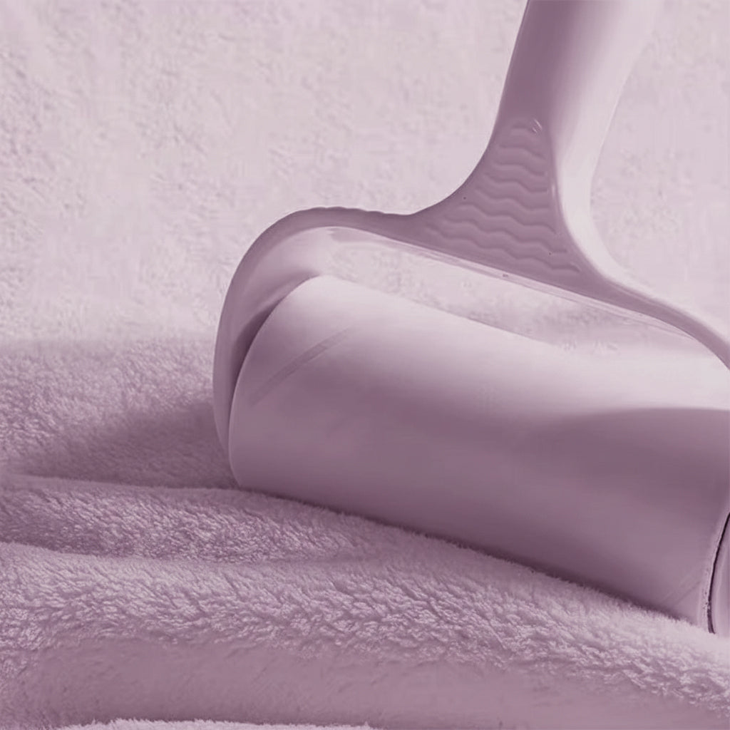 Close-up of a purple textured fabric with a hanger on a matching background